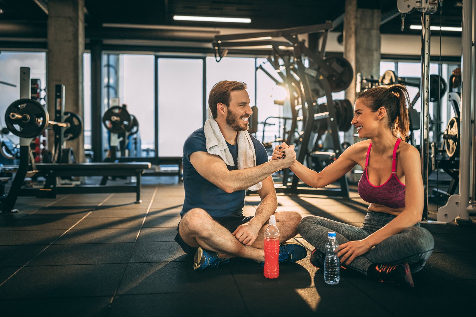 Trainer and client talking together after a workout